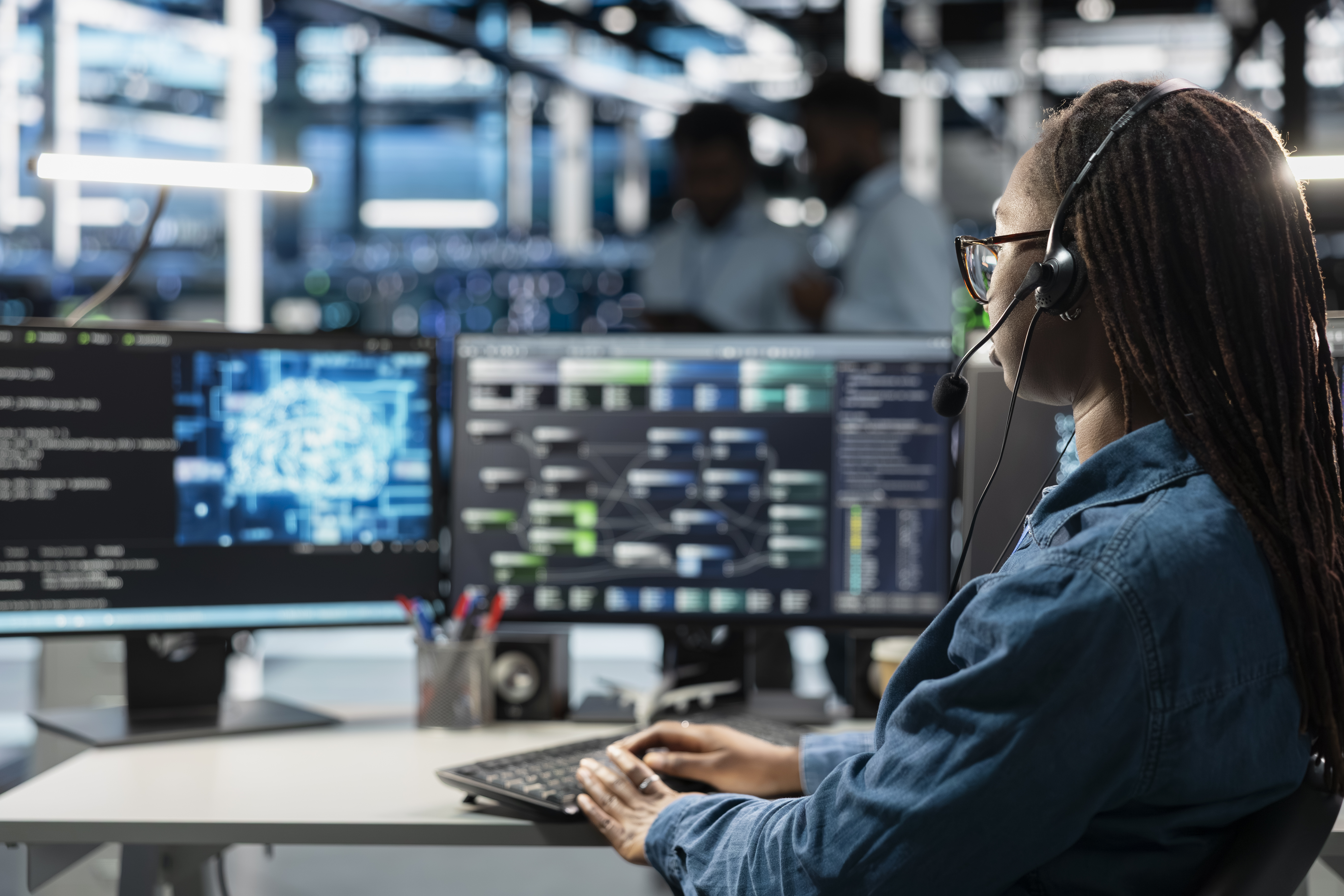 Data center support expert talking in headset microphone, supporting engineers service page
